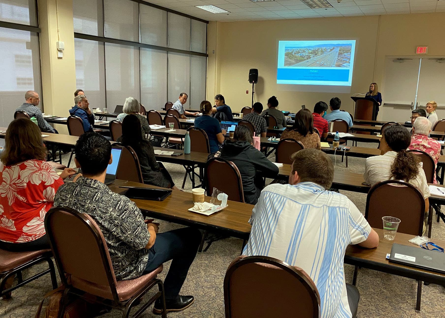 Approximately 20-30 students viewing a presentation at the September 2023 Transportation Project Management Training Program.